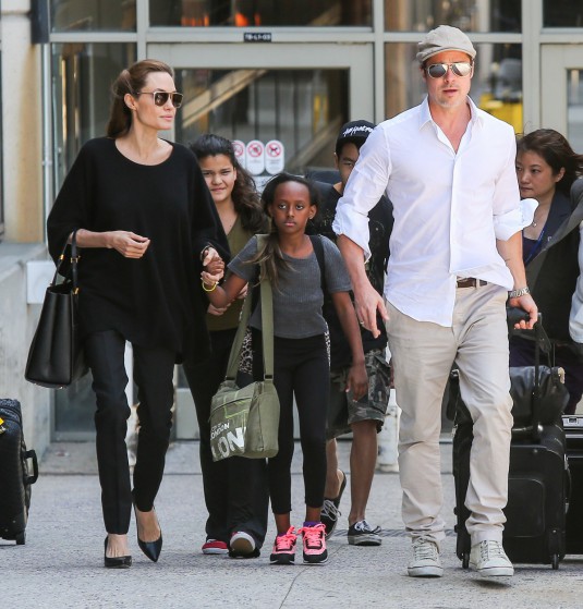 Angelina Jolie & Brad Pitt With Zahara and Maddox Arrive on a Flight at LAX
